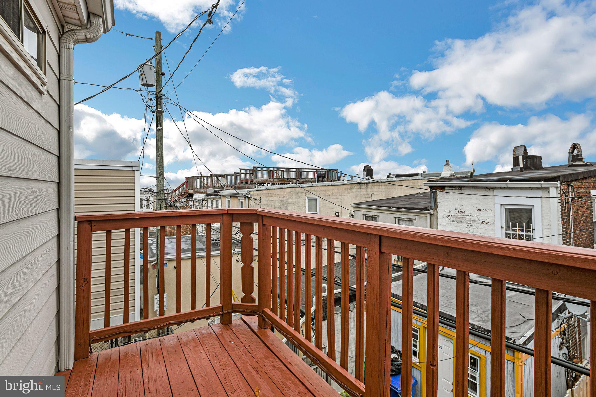 129 North Duncan Street Baltimore, MD 21231 - Photo 34 of 34 a view of a balcony with wooden floor and fence