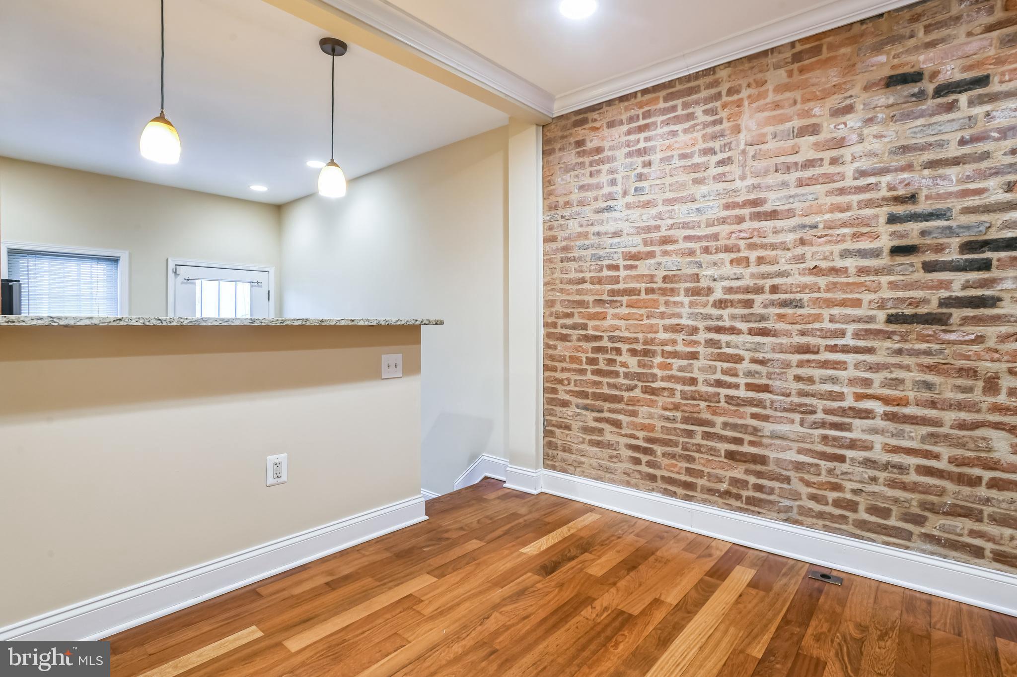 129 North Duncan Street Baltimore, MD 21231 - Photo 9 of 34 a view of empty room with wooden floor