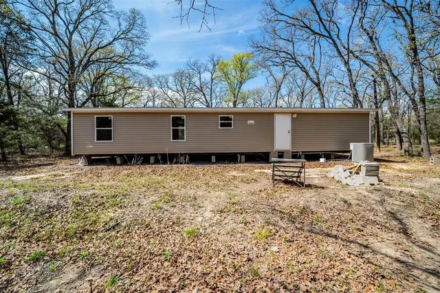 a house with trees in front of it