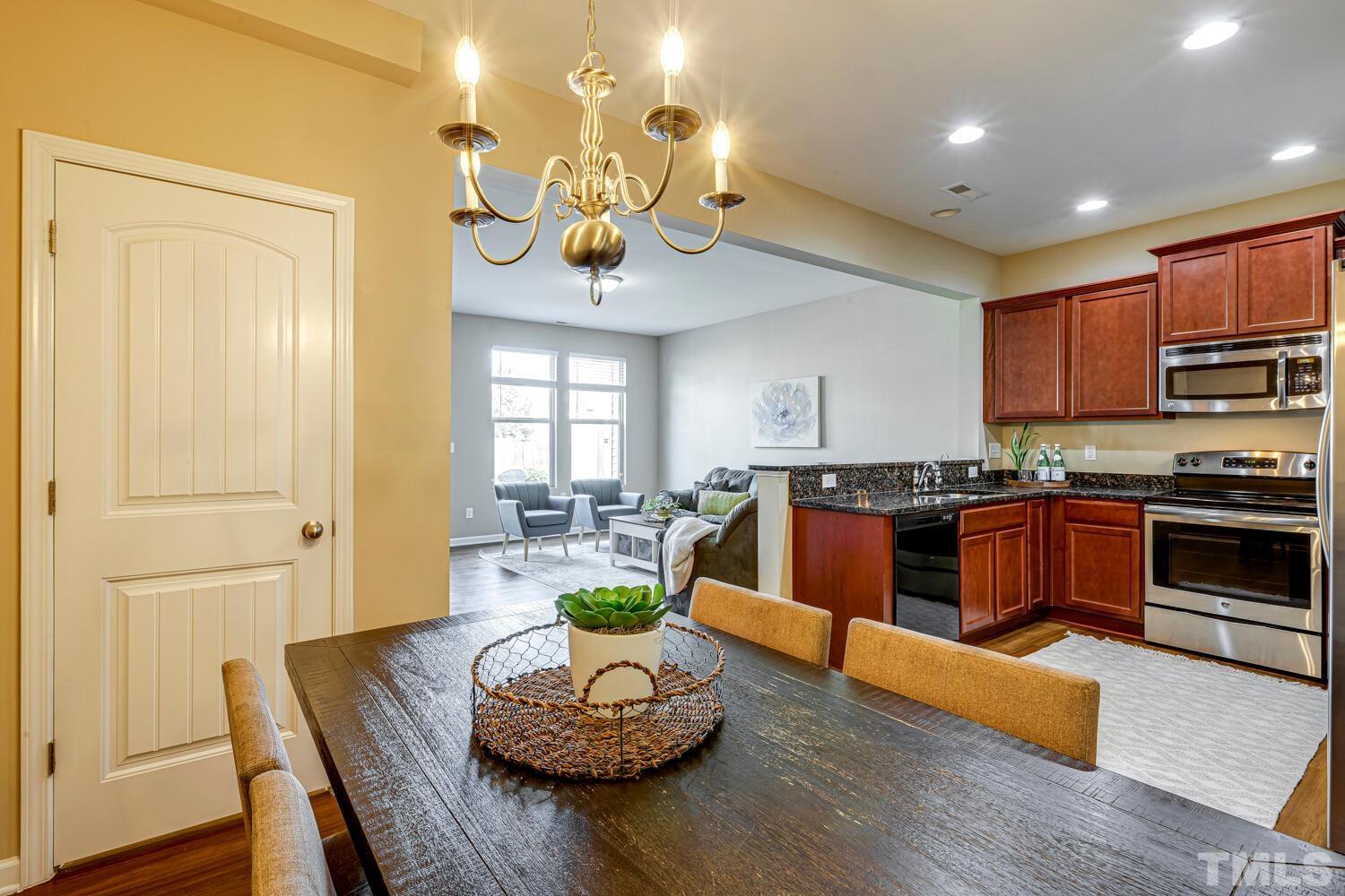 2416 Savior Street Raleigh, NC 27610 - Photo 12 of 47 a large kitchen with a table and chairs