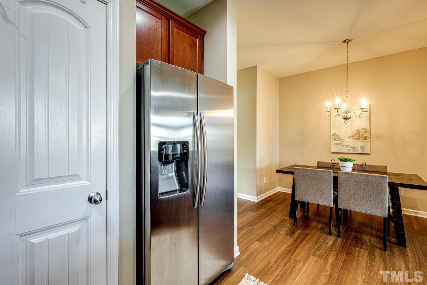 2416 Savior Street Raleigh, NC 27610 - Photo 18 of 47 a kitchen with a table and chairs