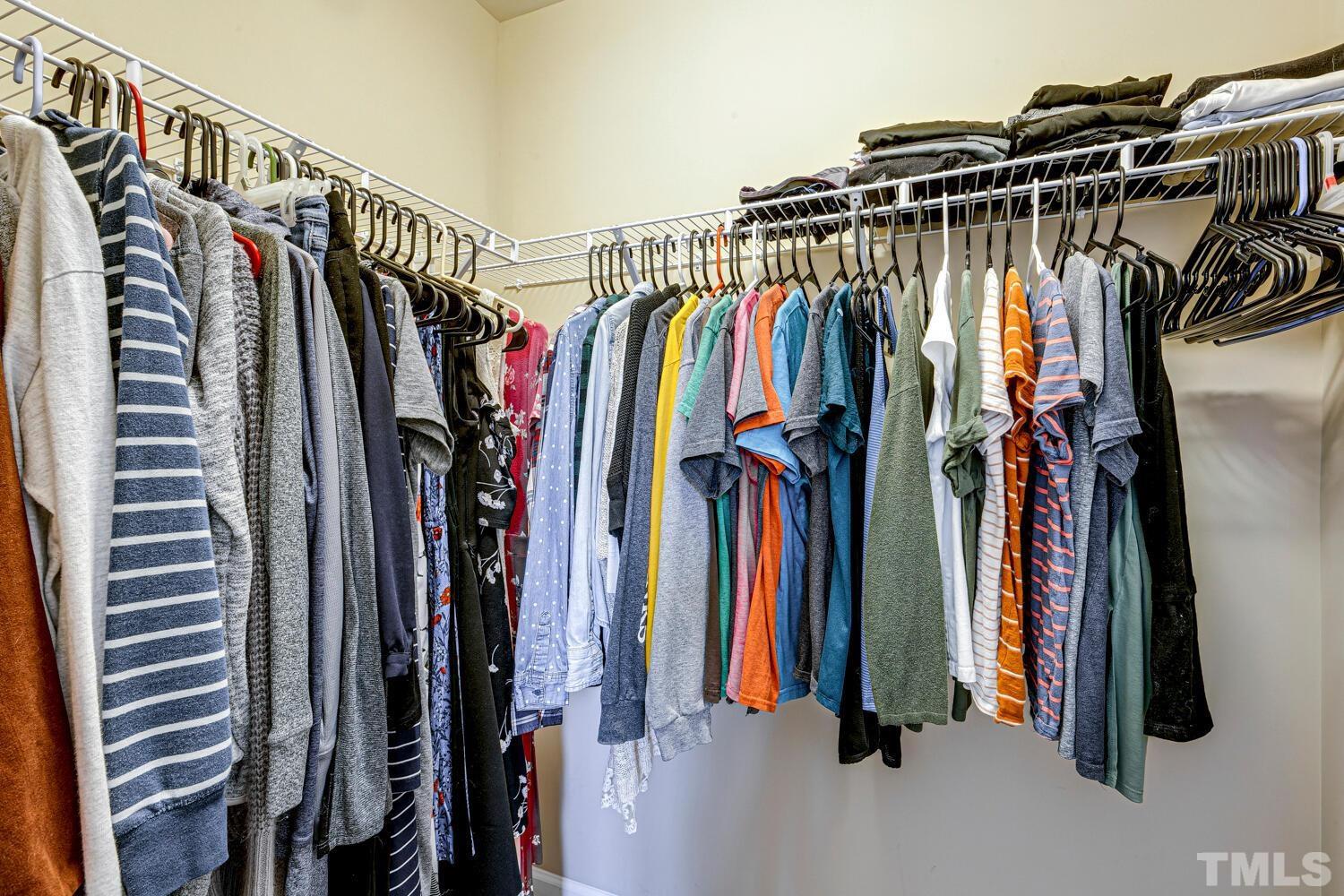 2416 Savior Street Raleigh, NC 27610 - Photo 26 of 47 a view of walk in closet with clothes and shoes