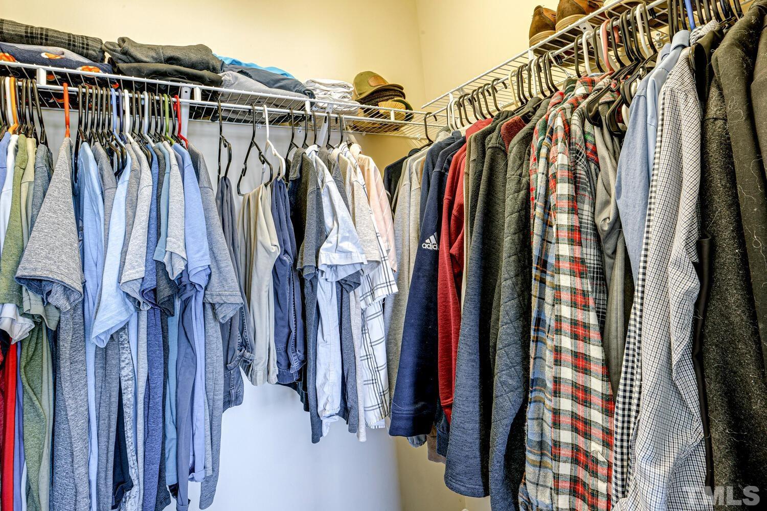 2416 Savior Street Raleigh, NC 27610 - Photo 27 of 47 a view of walk in closet with clothes and shoes