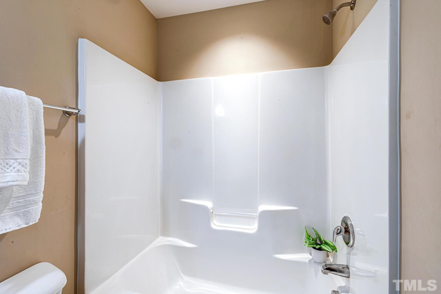 2416 Savior Street Raleigh, NC 27610 - Photo 33 of 47 a bathroom with a bathtub and a sink