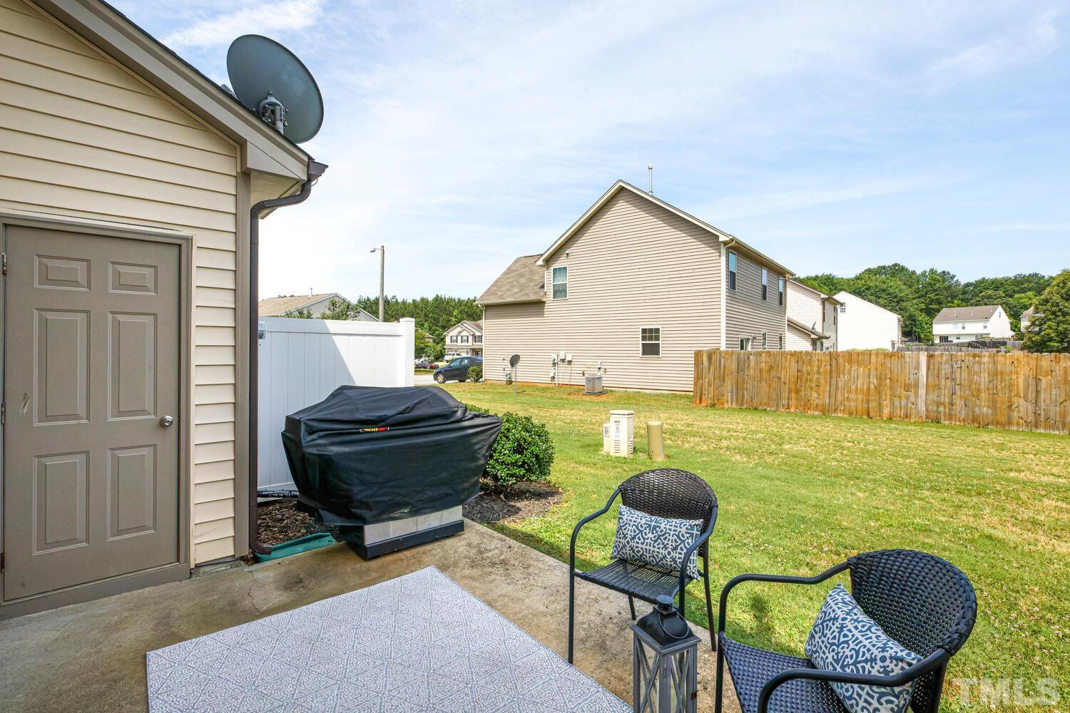2416 Savior Street Raleigh, NC 27610 - Photo 38 of 47 a backyard of a house with table and chairs