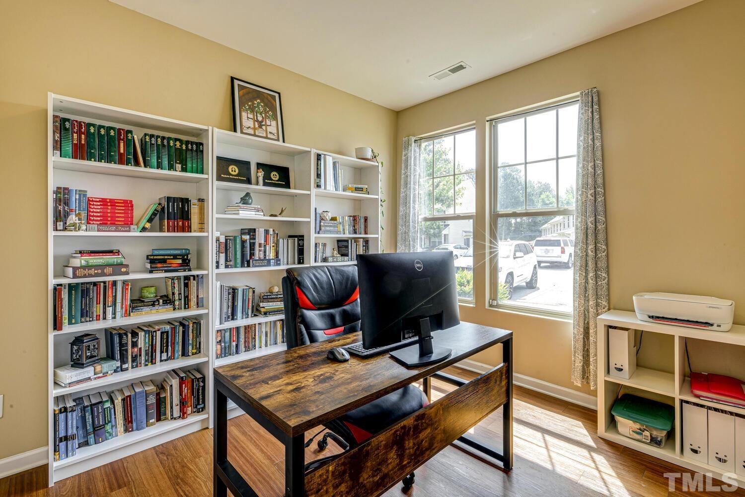 2416 Savior Street Raleigh, NC 27610 - Photo 6 of 47 a work room with furniture bookshelf and a window