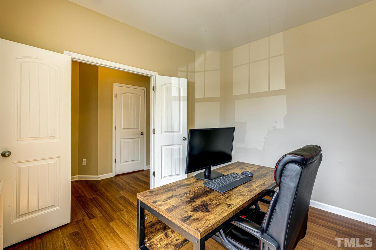 2416 Savior Street Raleigh, NC 27610 - Photo 8 of 47 a view of a workspace with furniture