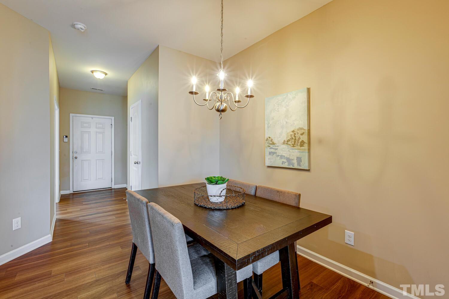 2416 Savior Street Raleigh, NC 27610 - Photo 10 of 47 a view of a dining room with furniture and wooden floor