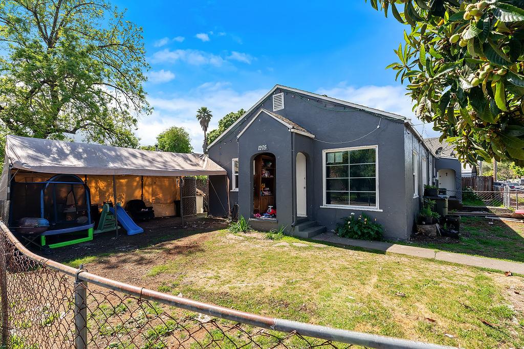 1205 Grand Avenue Santa Rosa, CA 95404 - Photo 1 of 27 a front view of a house with garden