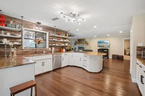 a kitchen with furniture and a counter top space