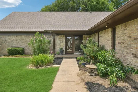 a house view with a garden space