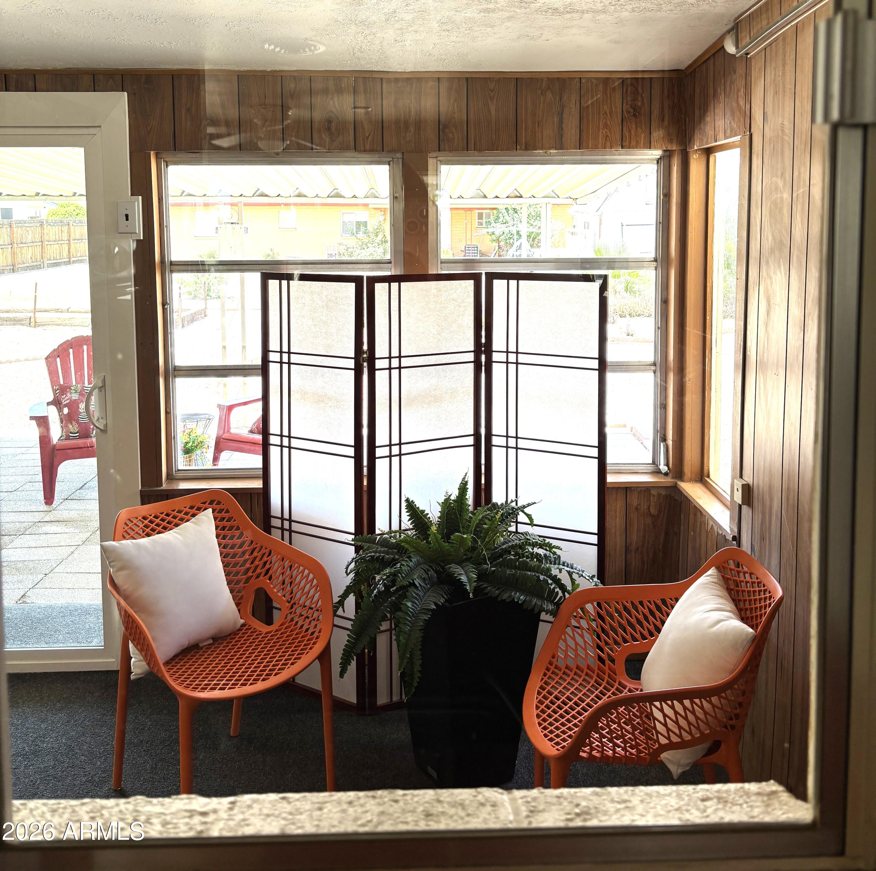 5437 East Butte Street Mesa, AZ 85205 - Photo 22 of 56 a living room with furniture and a floor to ceiling window