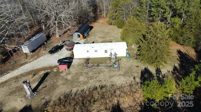 a view of road with large trees