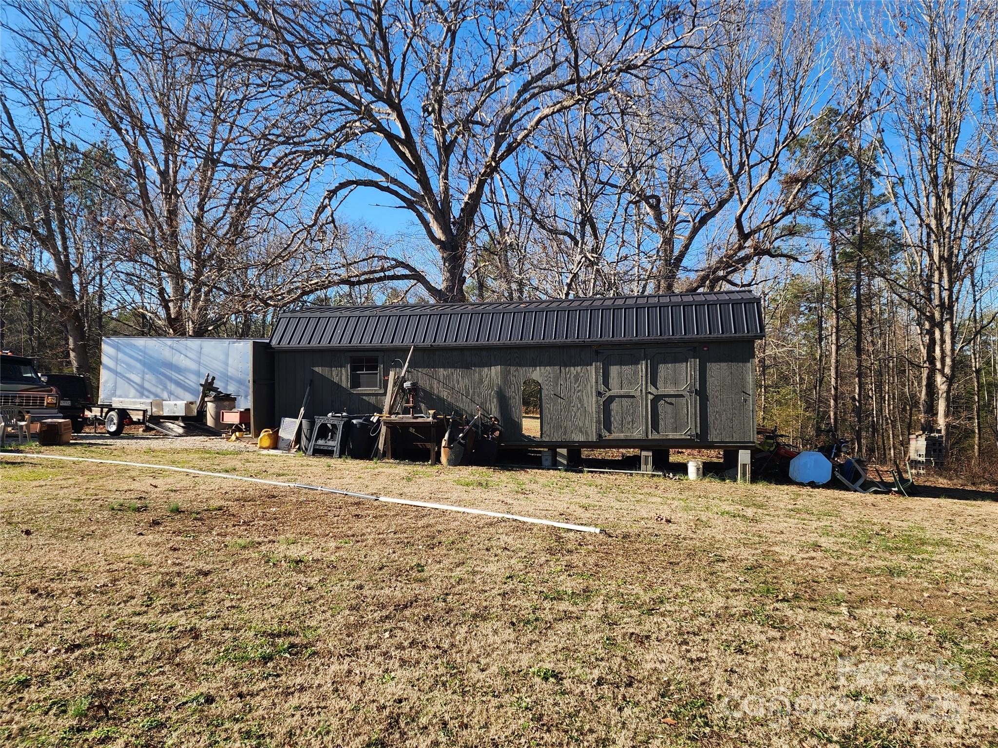1342 McKnight Road Smyrna, SC 29743 - Photo 16 of 39 a view of a house with a yard covered with snow in front of house