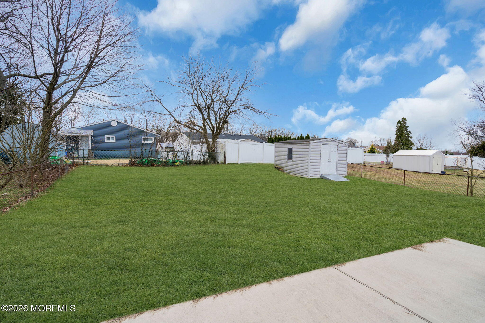 16 Hemlock Drive Parlin, NJ 08859 - Photo 20 of 22 a view of a yard with a large tree