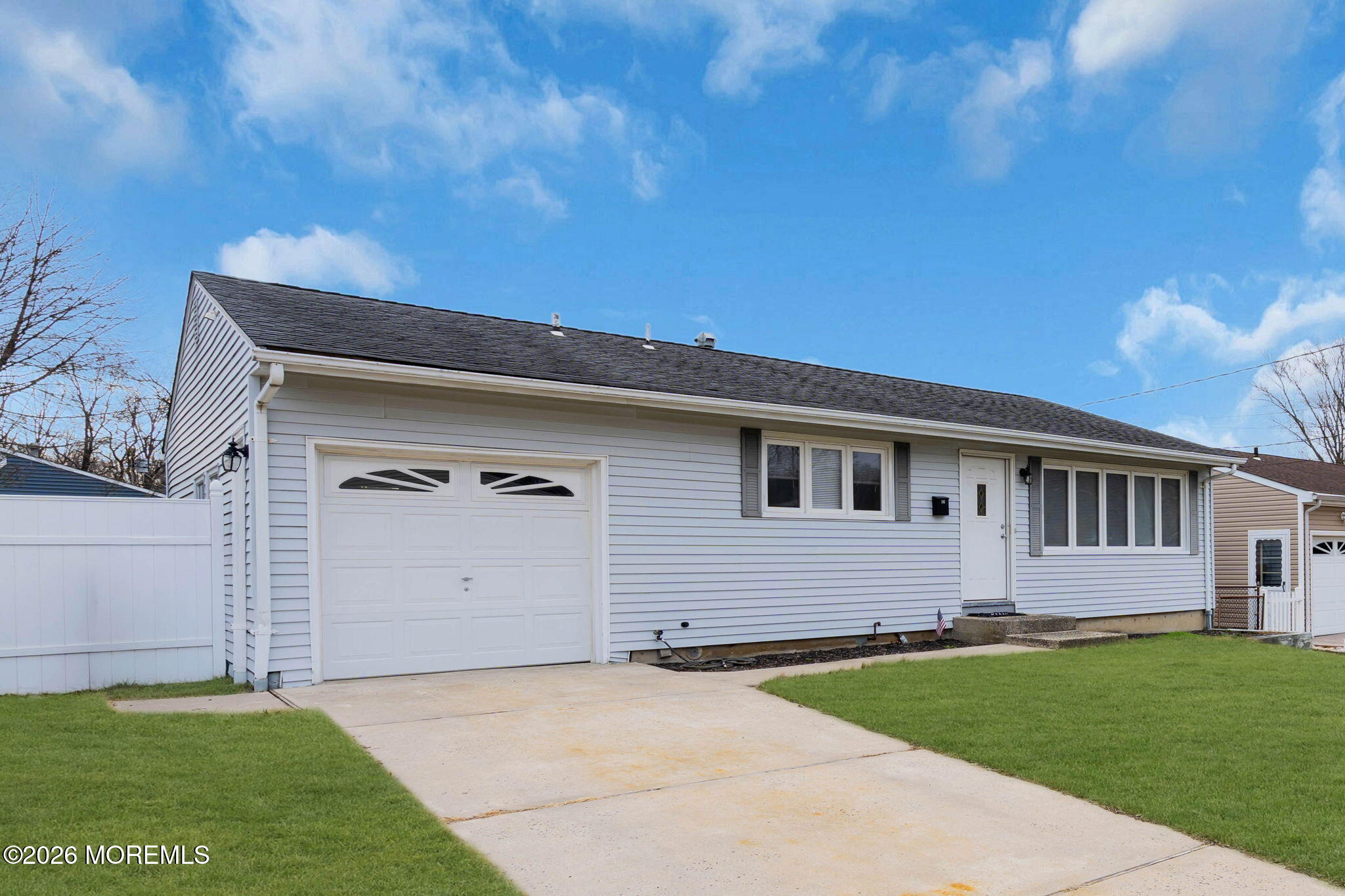 16 Hemlock Drive Parlin, NJ 08859 - Photo 2 of 22 a front view of a house with a yard and garage