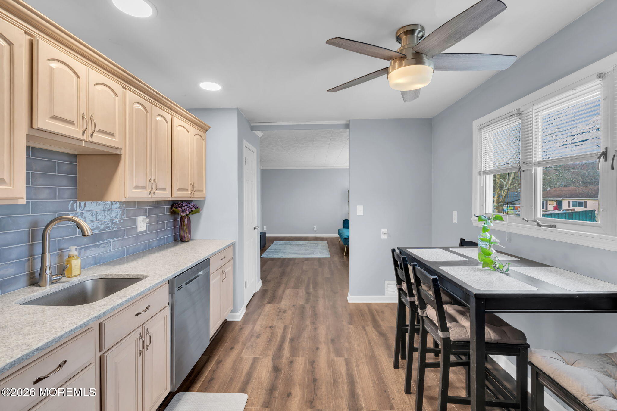 16 Hemlock Drive Parlin, NJ 08859 - Photo 9 of 22 a kitchen with a dining table chairs and white cabinets
