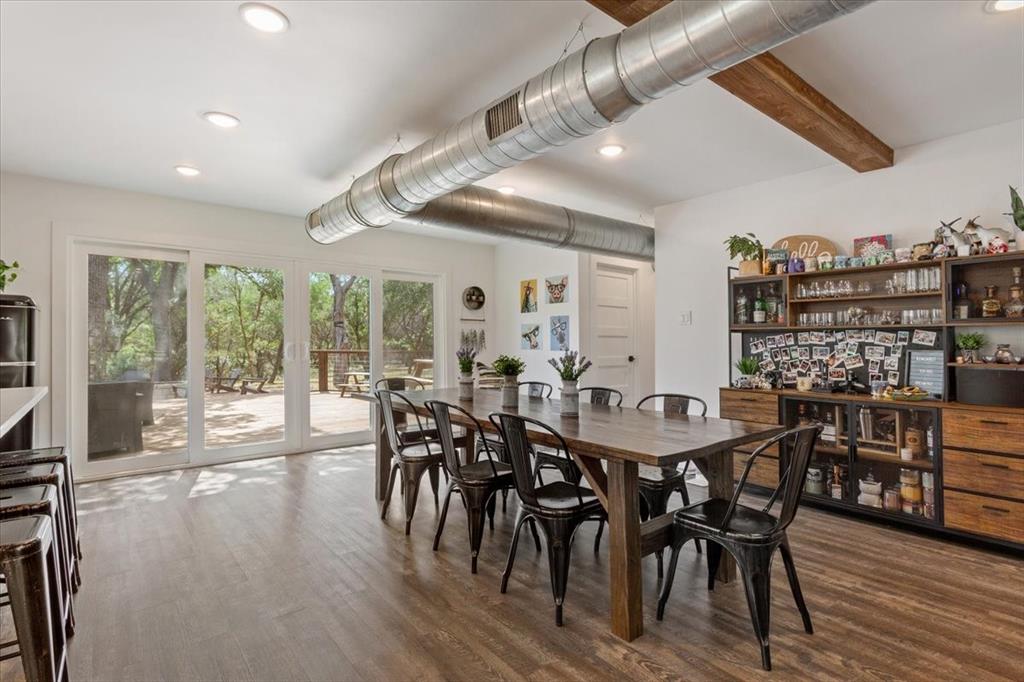 15988 Wortham Bend Road China Spring, TX 76633 - Photo 7 of 40 Spacious dining area featuring wood-finish flooring, recessed lighting, and exposed ceiling ductwork