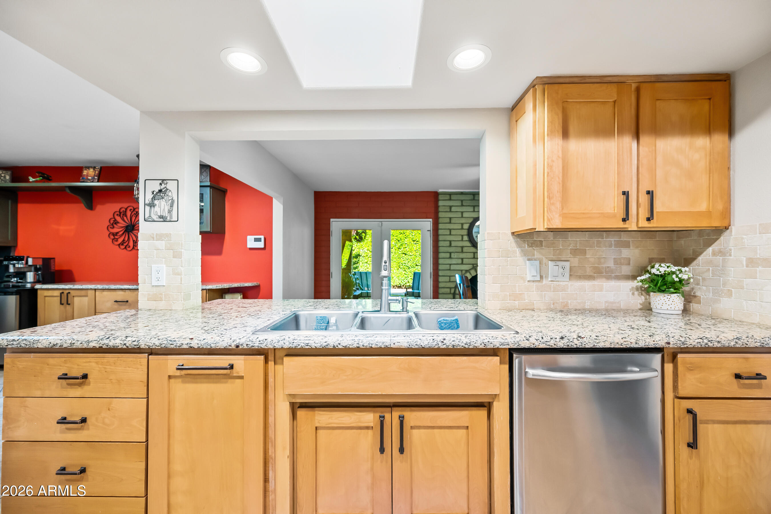 5802 South Stanley Place Tempe, AZ 85283 - Photo 14 of 50 a kitchen with granite countertop stainless steel appliances a sink and a granite counter tops