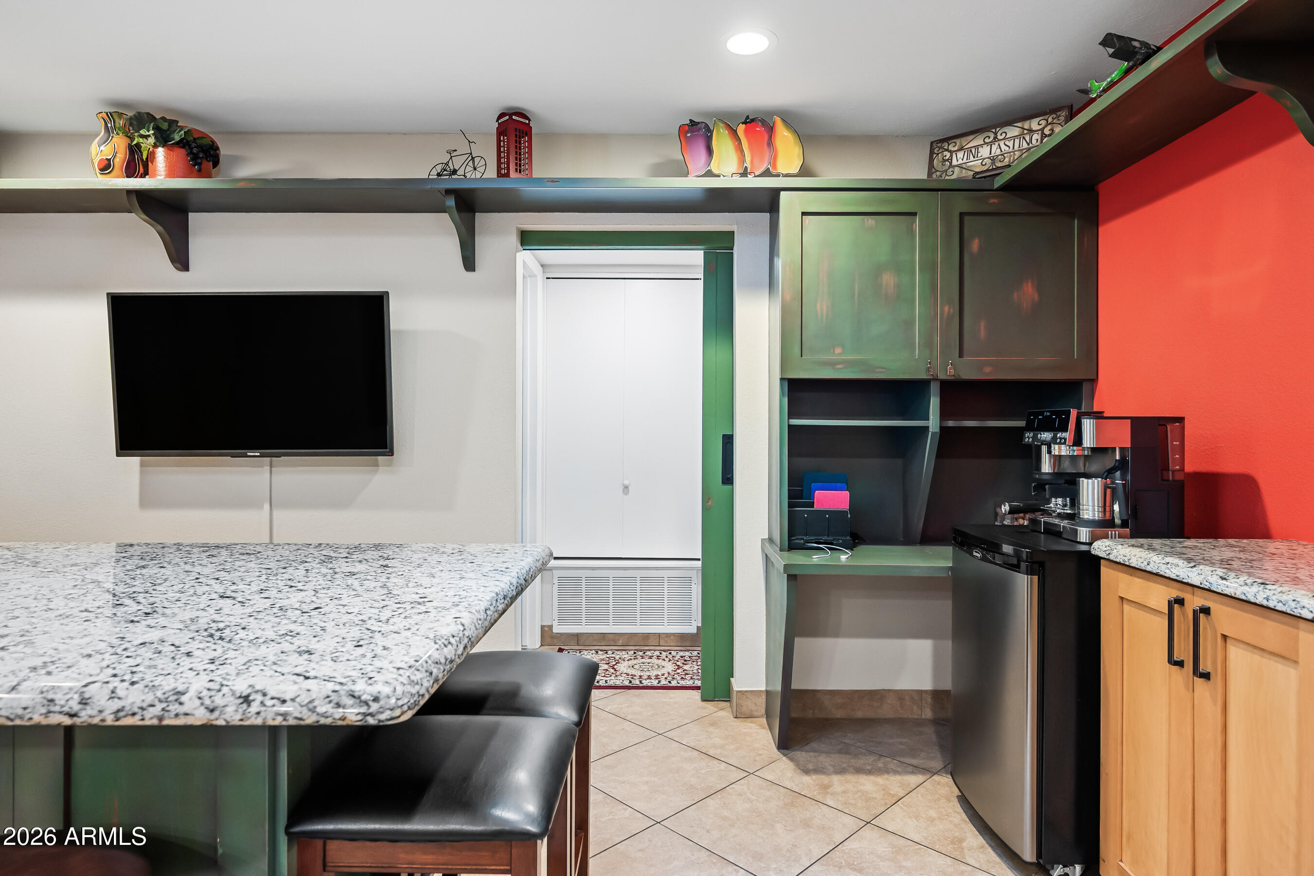 5802 South Stanley Place Tempe, AZ 85283 - Photo 15 of 50 a living room with stainless steel appliances kitchen island granite countertop furniture and a flat screen tv