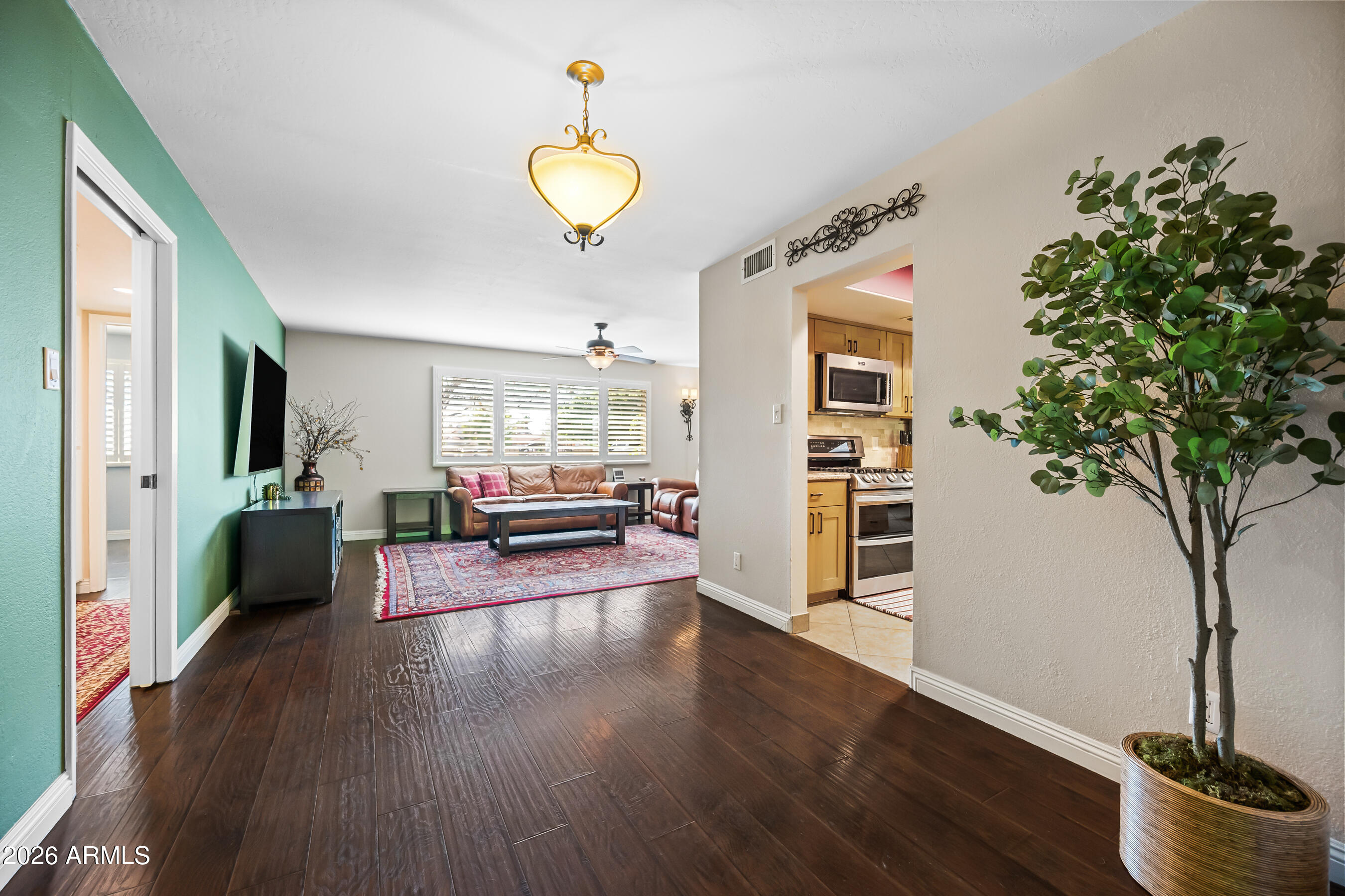 5802 South Stanley Place Tempe, AZ 85283 - Photo 20 of 50 a view of a living room and hardwood floor