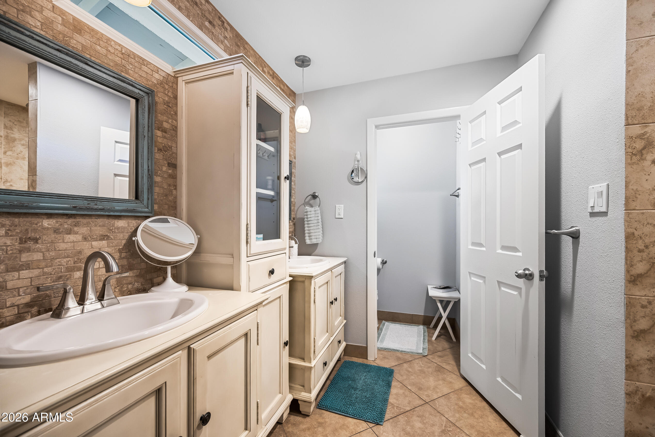 5802 South Stanley Place Tempe, AZ 85283 - Photo 23 of 50 a bathroom with a sink and a mirror