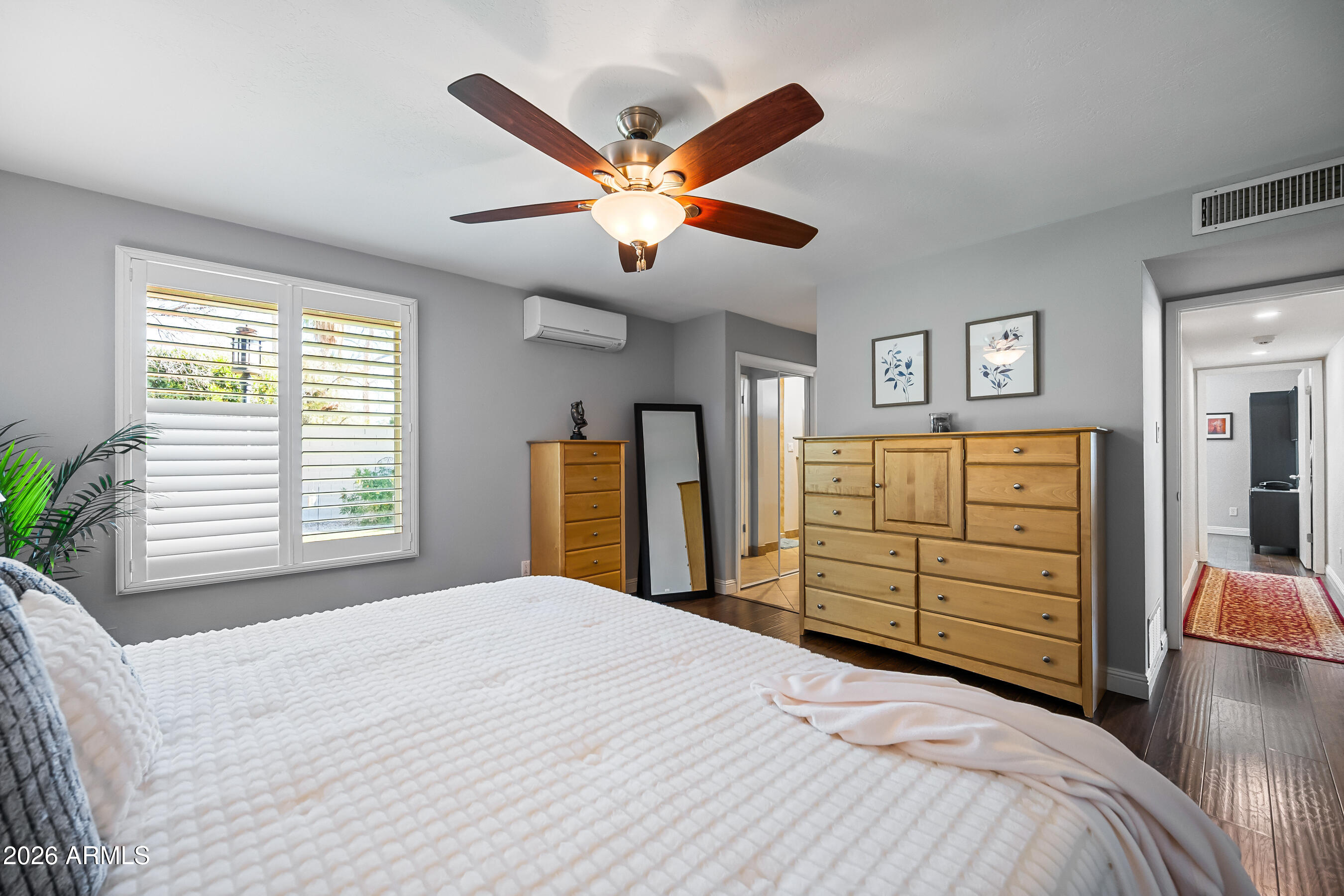 5802 South Stanley Place Tempe, AZ 85283 - Photo 26 of 50 a bedroom with a bed and a chandelier