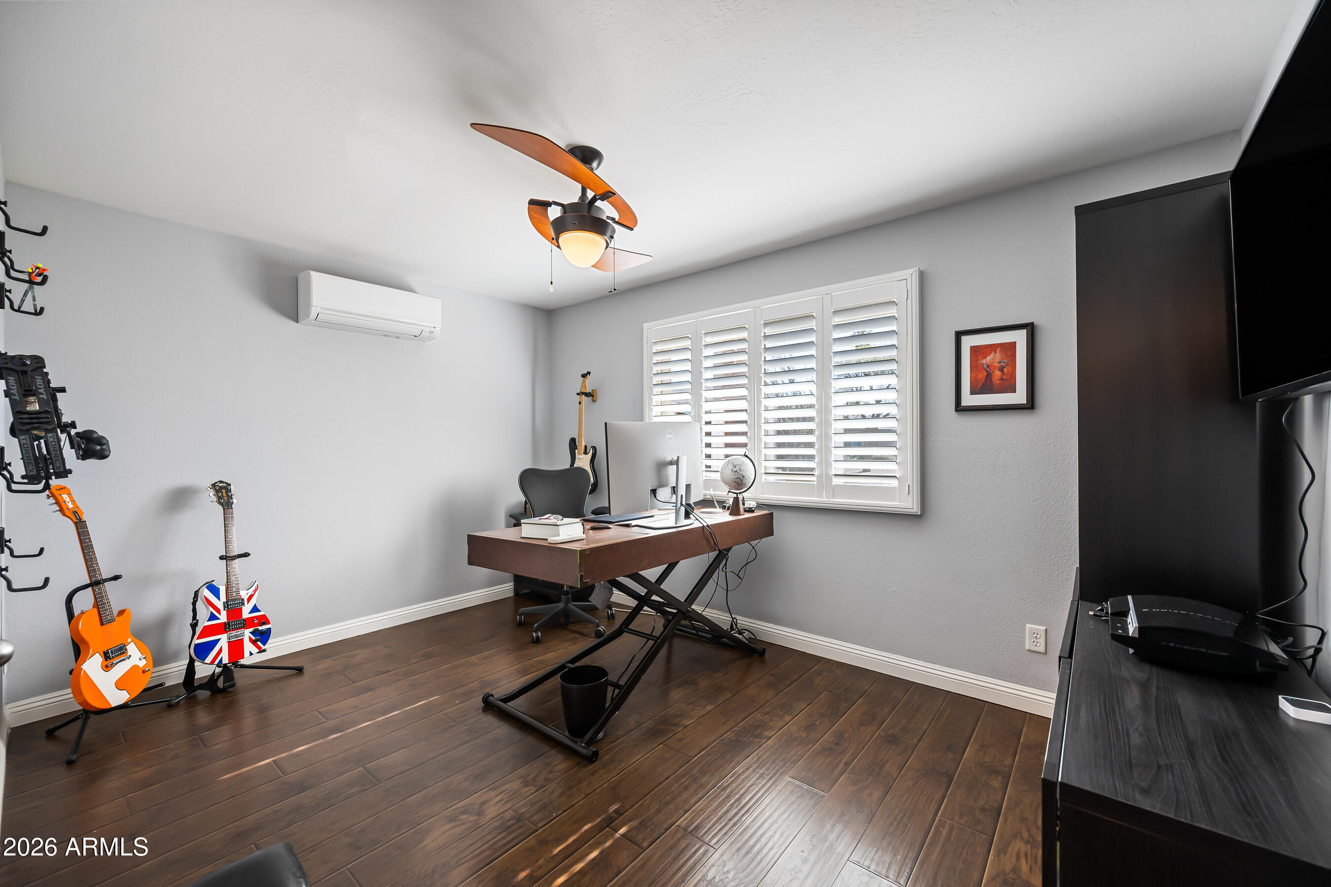 5802 South Stanley Place Tempe, AZ 85283 - Photo 27 of 50 a view of a workspace with furniture and wooden floor