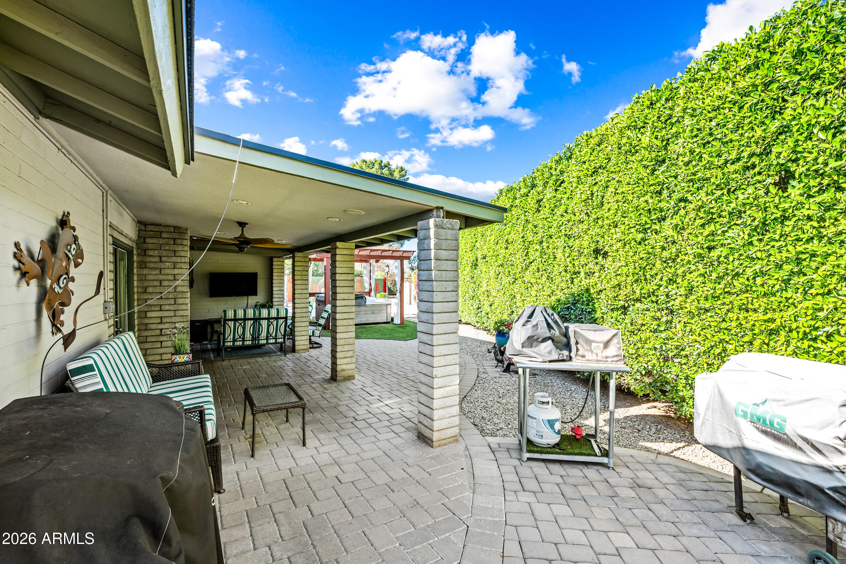 5802 South Stanley Place Tempe, AZ 85283 - Photo 36 of 50 a patio with table and chairs and potted plants