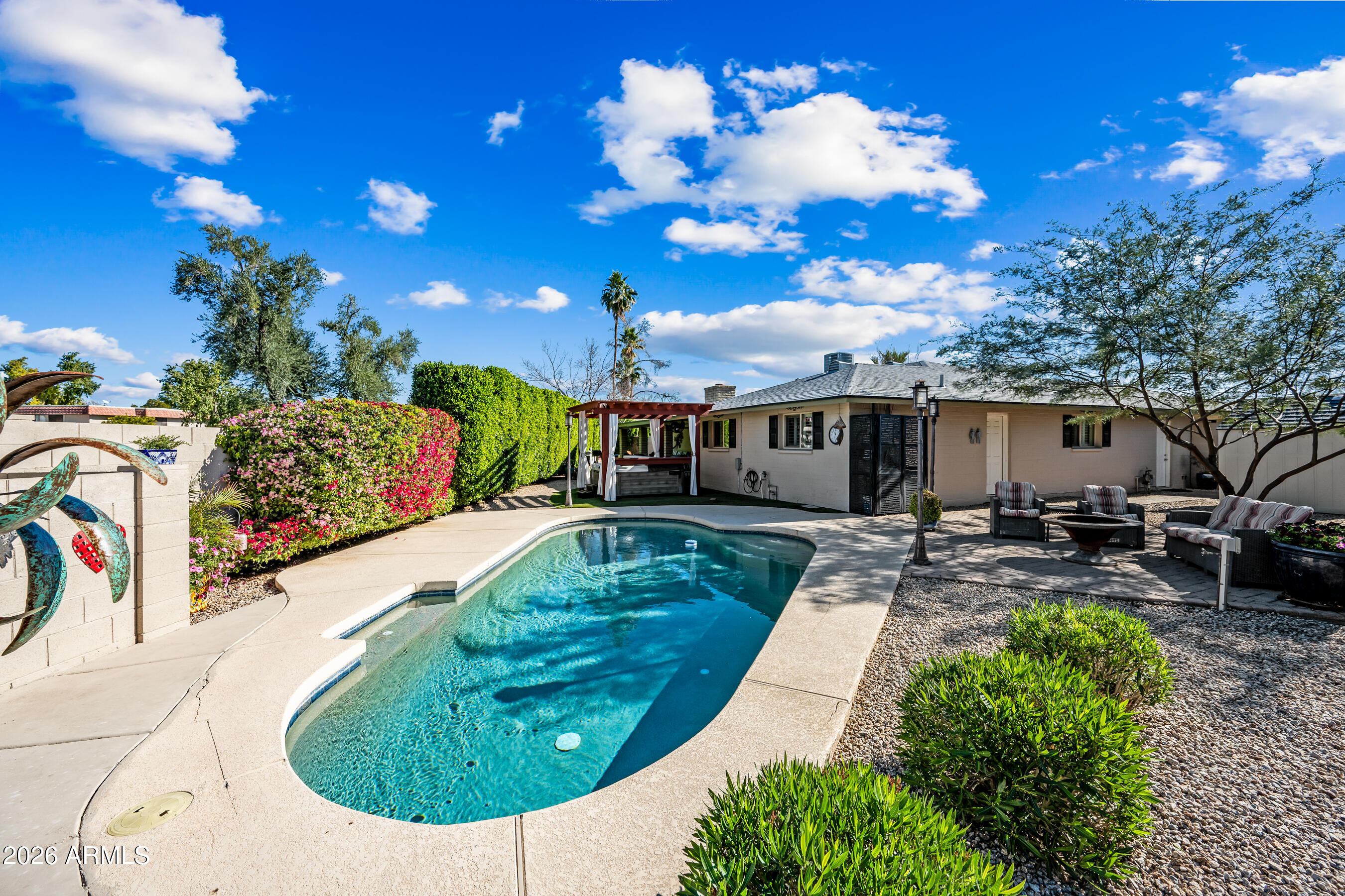 5802 South Stanley Place Tempe, AZ 85283 - Photo 40 of 50 a view of a house with swimming pool and sitting area