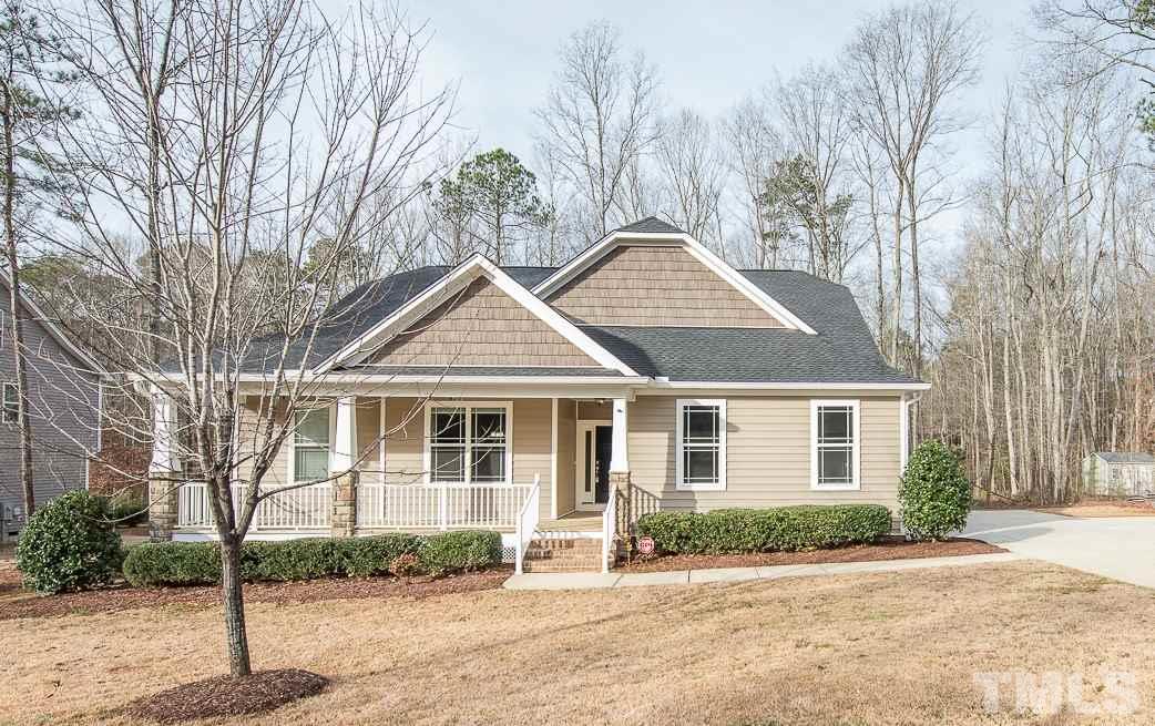 1136 Farmers Branch Road Willow Spring, NC 27592 - Photo 1 of 30 a front view of a house with a yard