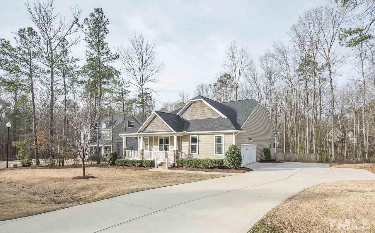1136 Farmers Branch Road Willow Spring, NC 27592 - Photo 2 of 30 a front view of a house with a yard