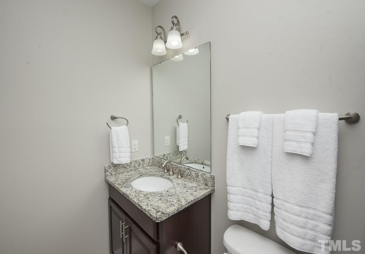 1136 Farmers Branch Road Willow Spring, NC 27592 - Photo 20 of 30 a bathroom with a sink and a mirror