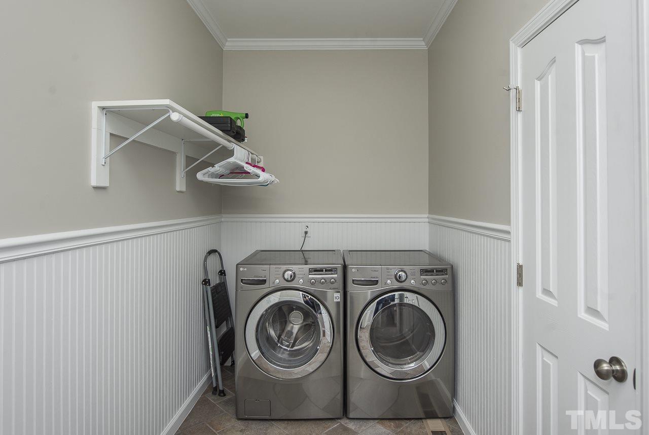 1136 Farmers Branch Road Willow Spring, NC 27592 - Photo 23 of 30 a utility room with dryer and washer