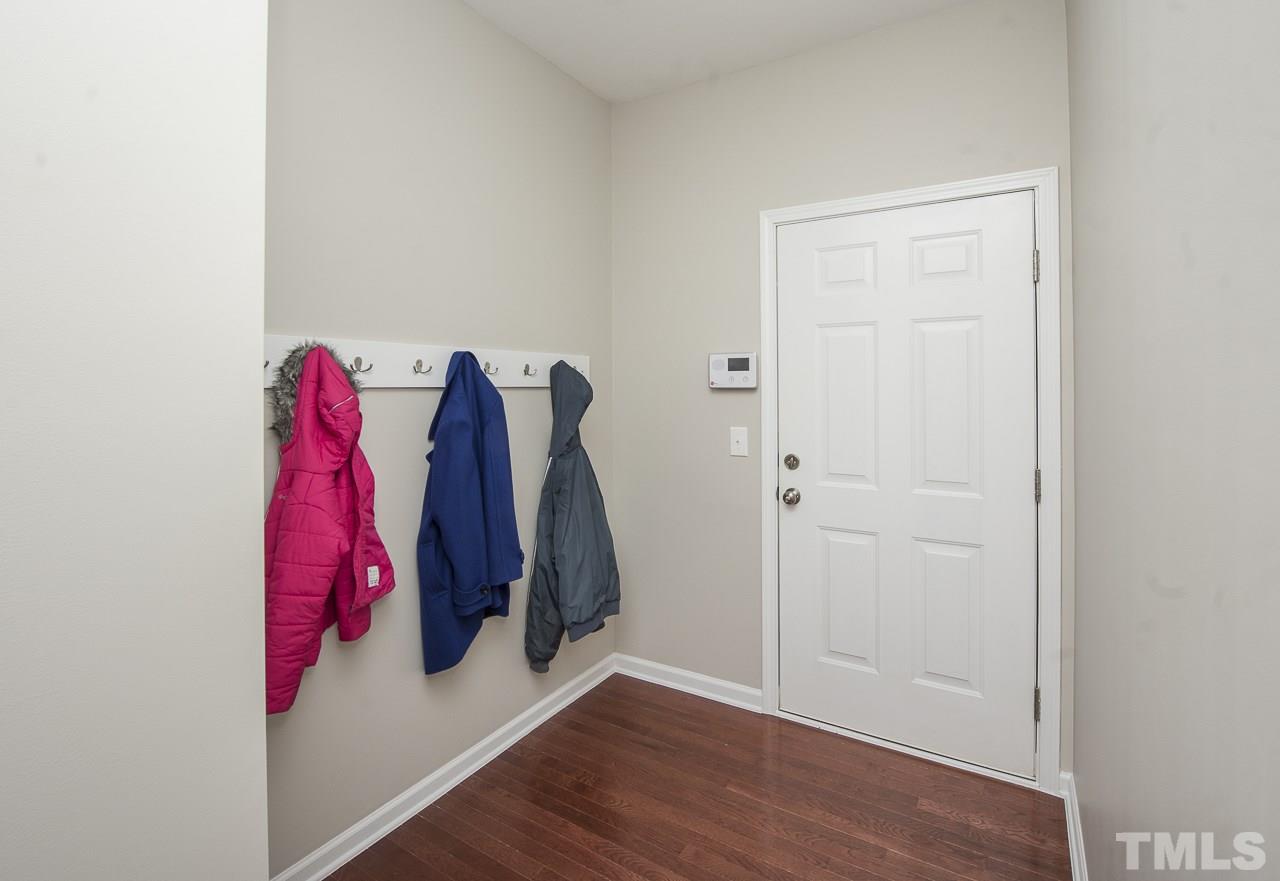 1136 Farmers Branch Road Willow Spring, NC 27592 - Photo 24 of 30 a view of walk in closet with clothes