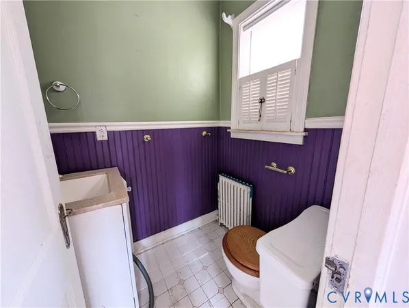 a bathroom with a toilet and a sink