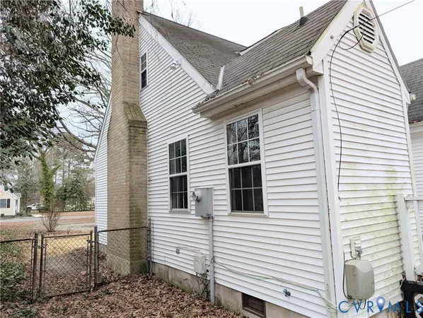 a view of a white house with a large windows