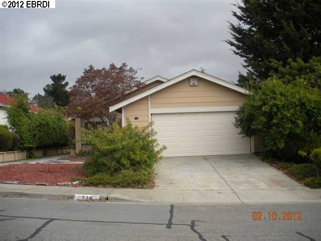 776 Coral Ridge Circle Rodeo, CA 94572 - Photo 1 of 1 a front view of a house with a yard and garage