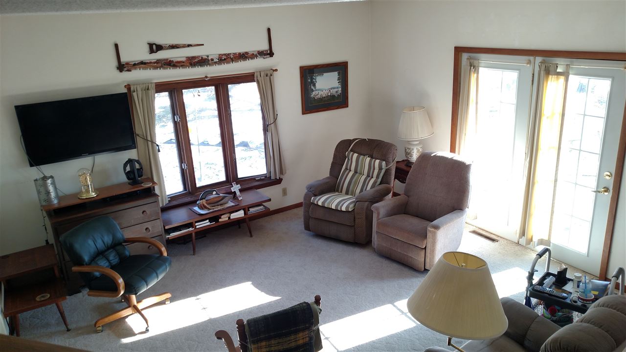 6164 East Flagg Road Ashton, IL 61006 - Photo 8 of 25 a living room with furniture and a flat screen tv