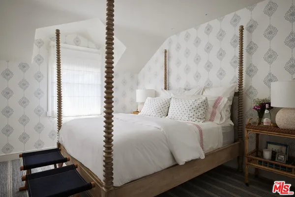 a bathroom with a sink vanity mirror and toilet