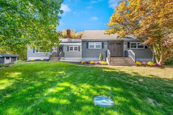a view of a house with a yard porch and sitting area