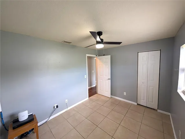 a very nice looking room with a ceiling fan
