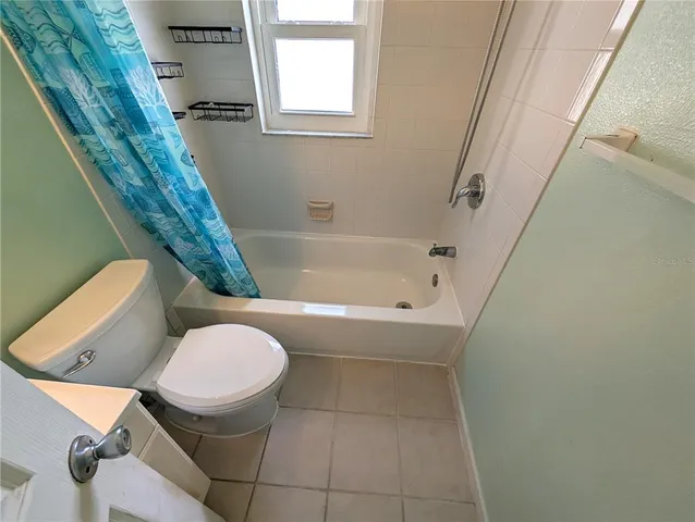 a bathroom with a toilet and a bathtub