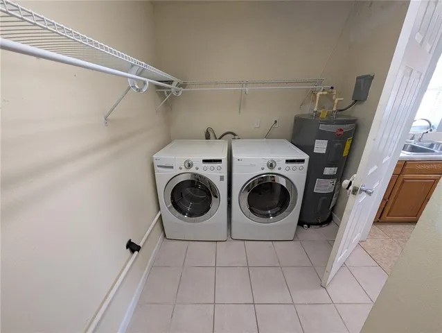 a utility room with dryer and washer