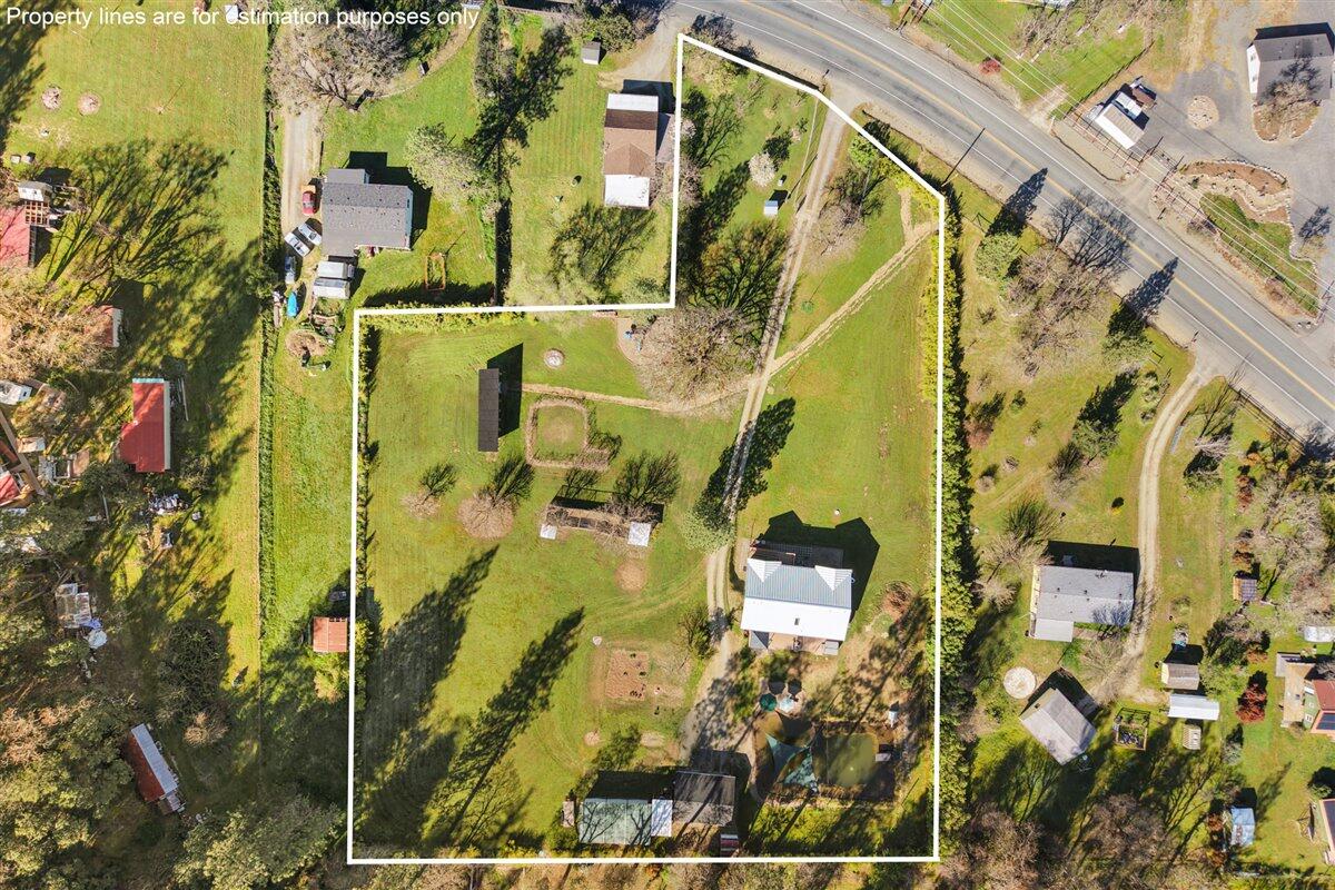649 Pleasant Valley Road Merlin, OR 97532 - Photo 57 of 57 an aerial view of residential houses with outdoor space