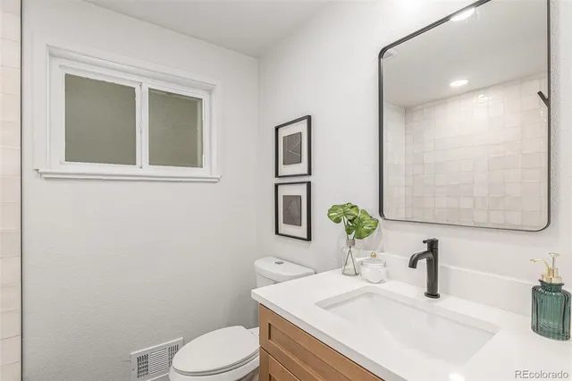 a living room with furniture pool table and a couch