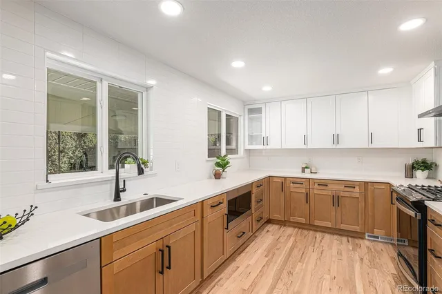 a workspace with furniture and a potted plant