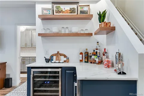 a bathroom with a sink a mirror a toilet and a shower