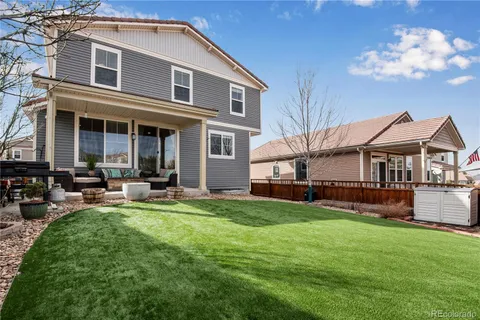 an outdoor space with furniture and umbrella
