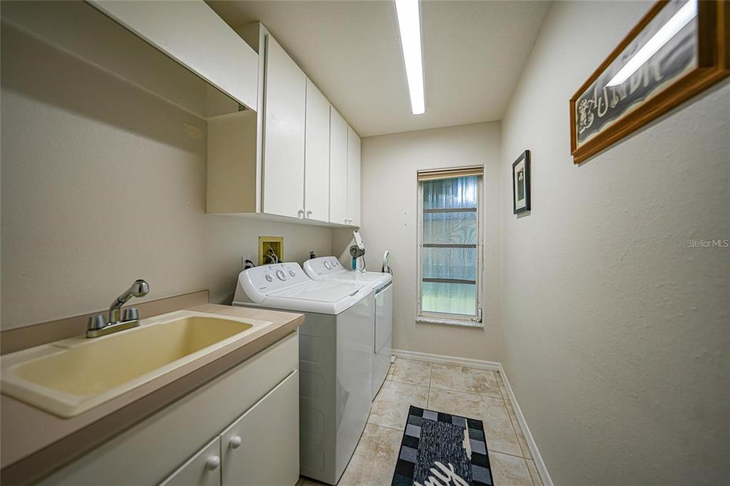 822 Vía Formia Punta Gorda, FL 33950 - Photo 21 of 33 a utility room with sink dryer and washer